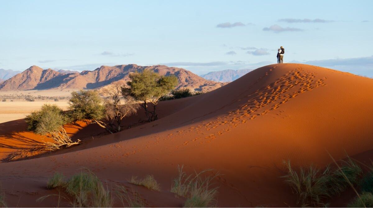 students-atop-dune-namibia